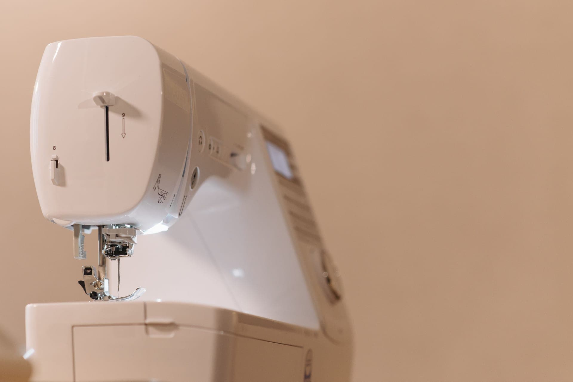 Close view of a modern sewing machine used in tailoring