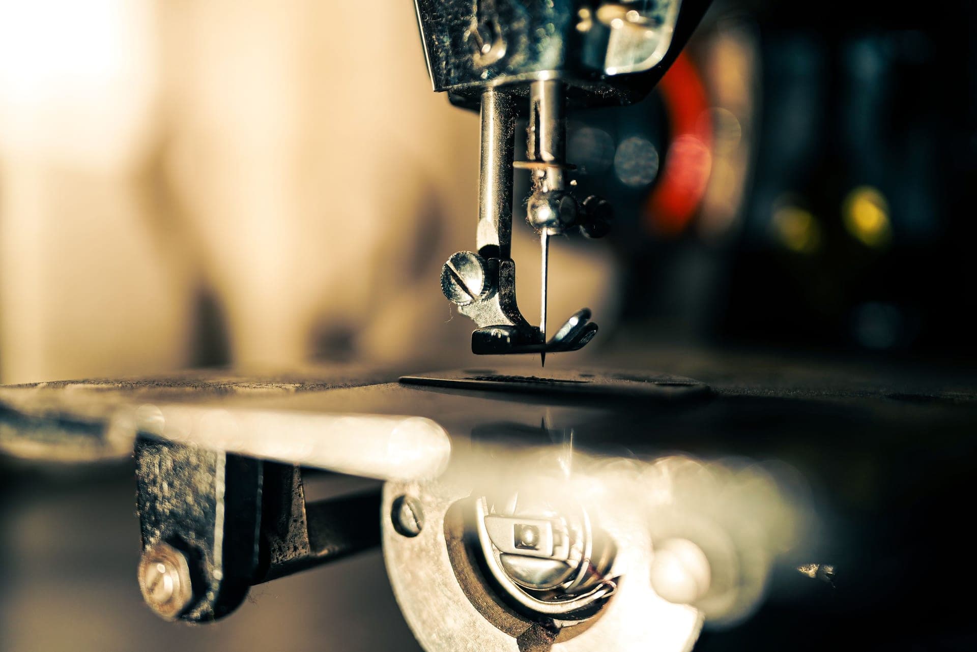Close view of a sewing machine needle and dial