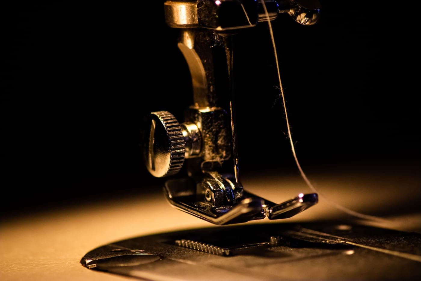 Close view of the controls of a basic sewing machine
