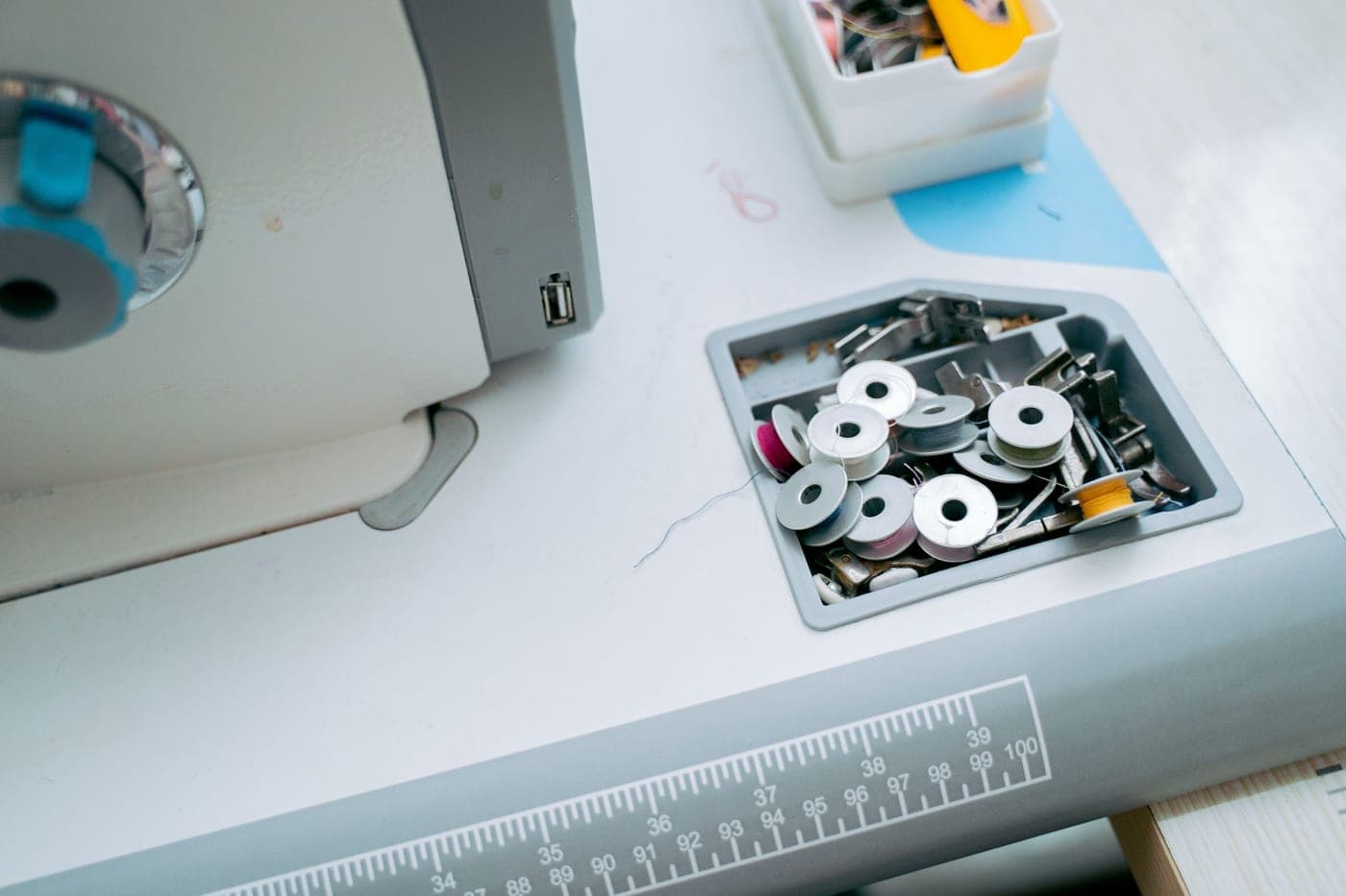 The spare thread spool compartment of a sewing machine
