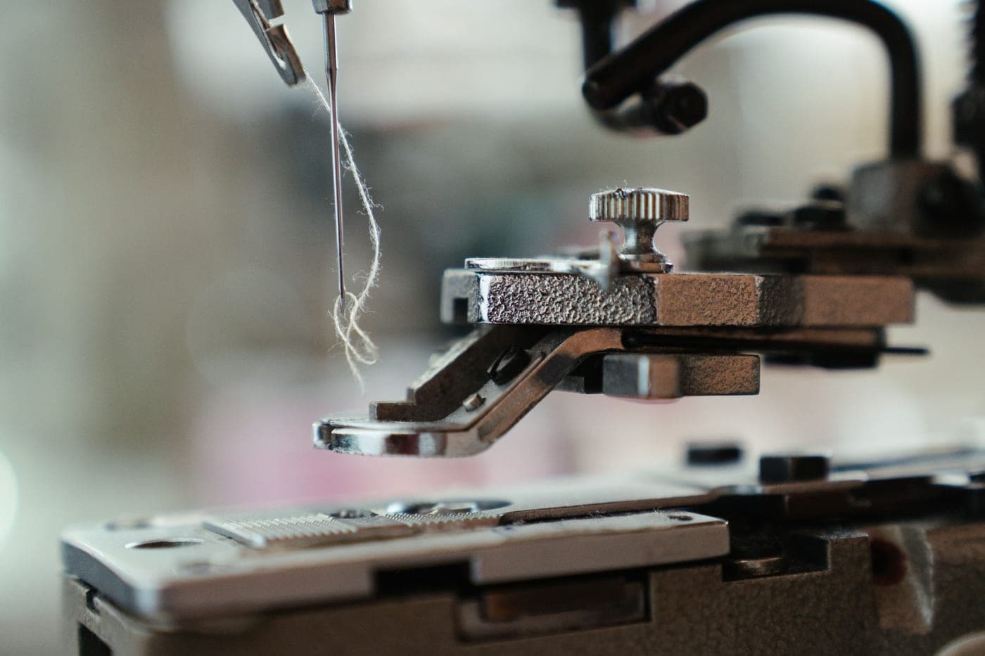 A black and silver sewing machine photographed close up