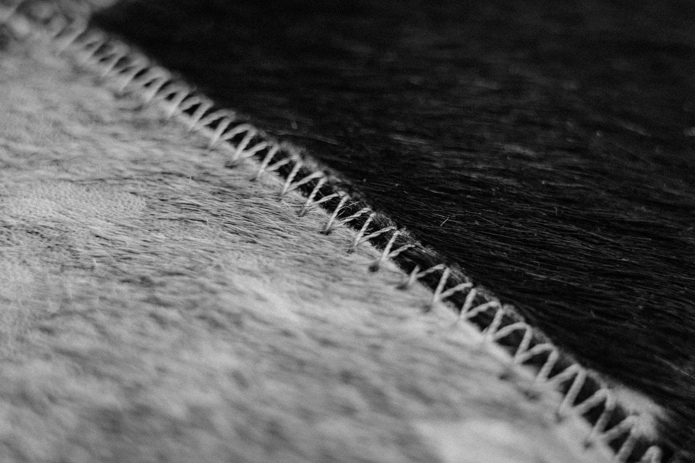 Close view of stitching on black and white fabric