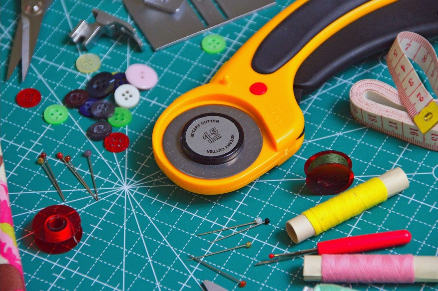 A sewing machine surrounded by assorted colored thread
